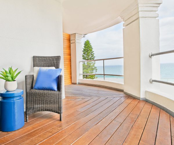 The King Beachfront Room at the Cottesloe Beach Hotel offers sweeping ocean views from its furnished balcony
