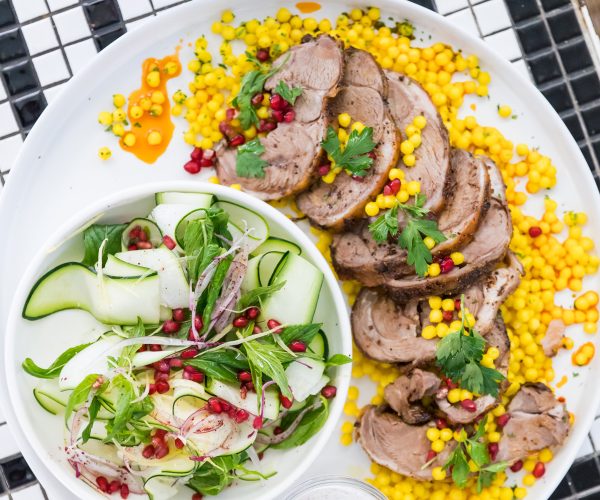 A large plate of roasted sliced lamb and salad, served at the Cottesloe Beach Hotel Restaurant